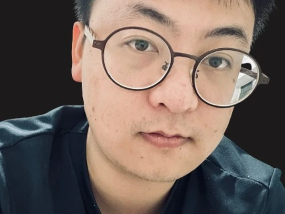 man with glasses in black shirt
