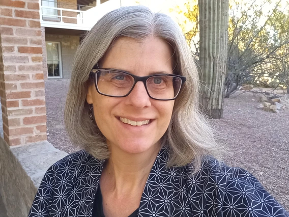 Woman with glasses smiling