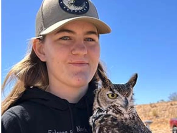 girl smiling with owl