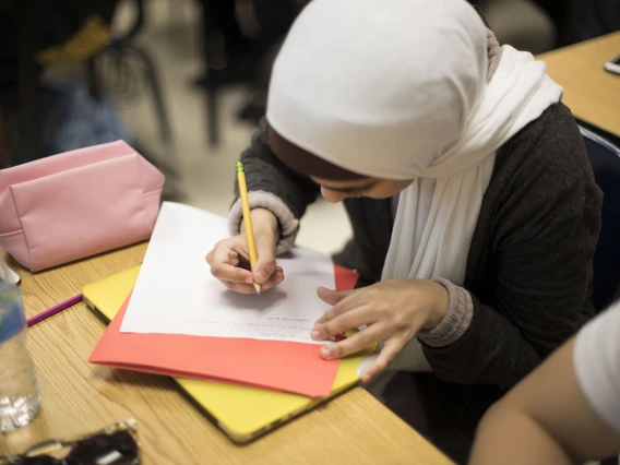 Female student writing in class