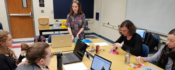 Students working with professor