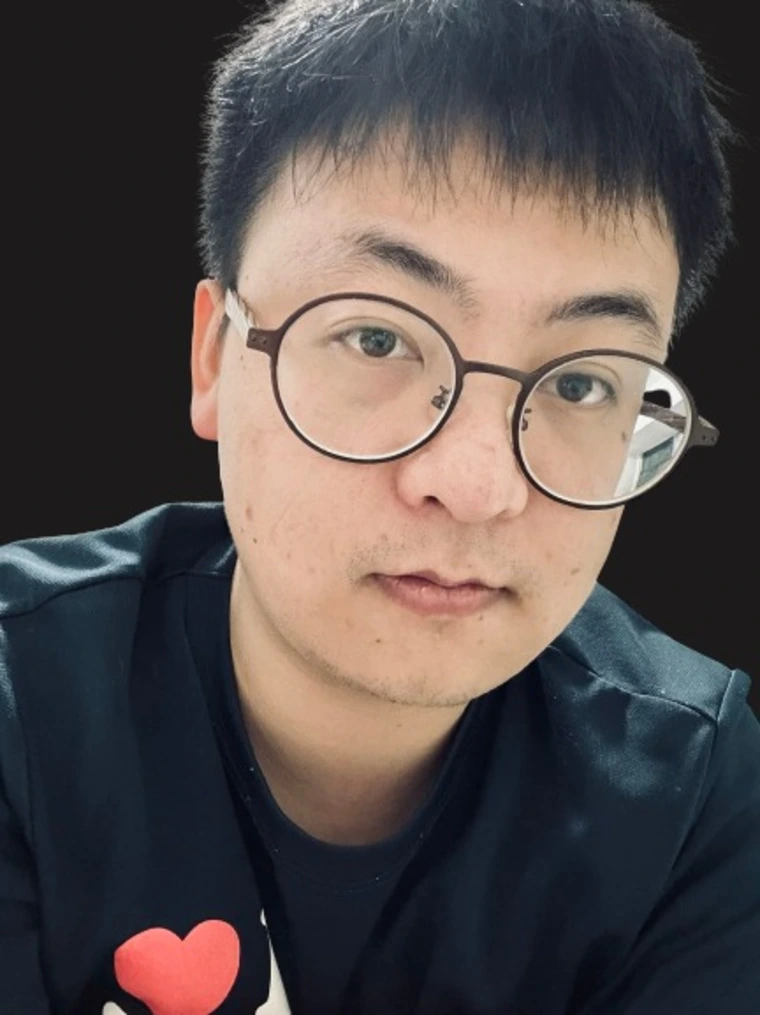 man with glasses in black shirt