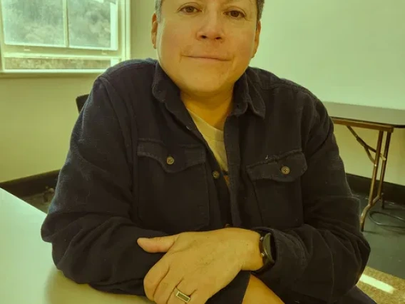 woman smiling at desk