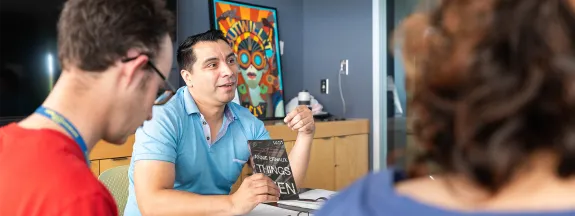 Professor introducing a book to his students