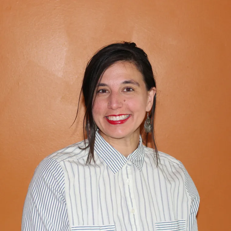 Woman with white shirt smiling