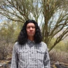 Man standing in front of tree