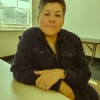 woman smiling at desk